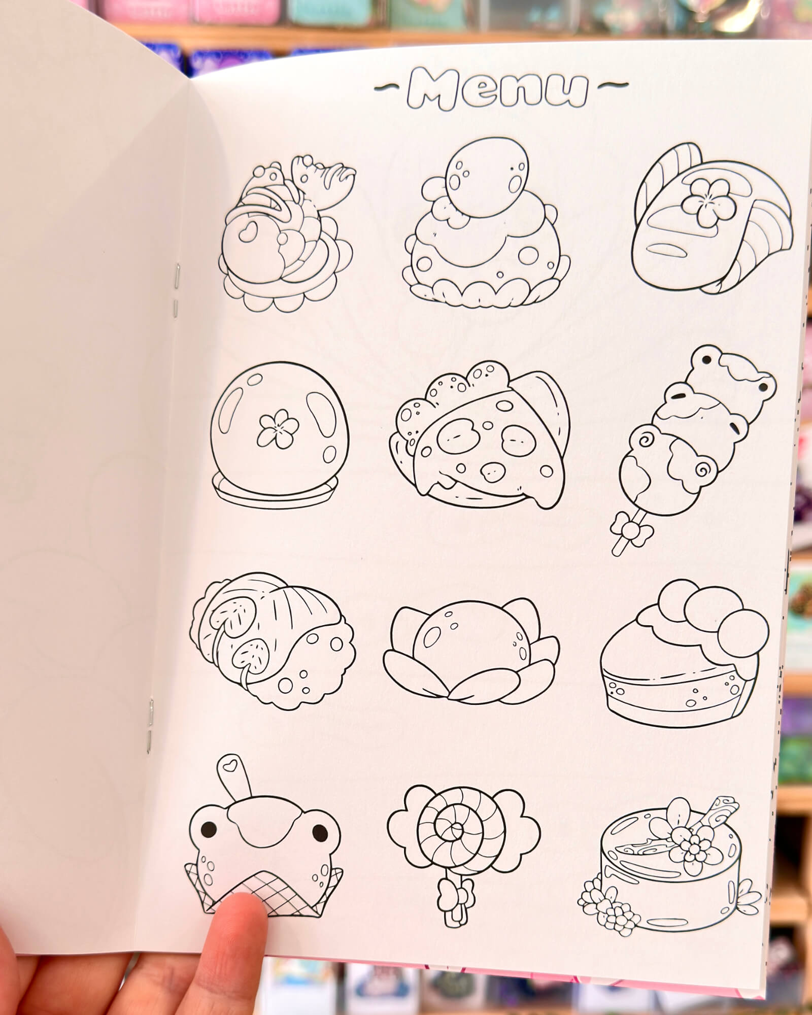 The Lotls in Lily Pond Valley Coloring Book 4 - Evy Benita Coloring-page illustration of dessert shapes: ice cream, donut, cupcake, and pastries in outline form.